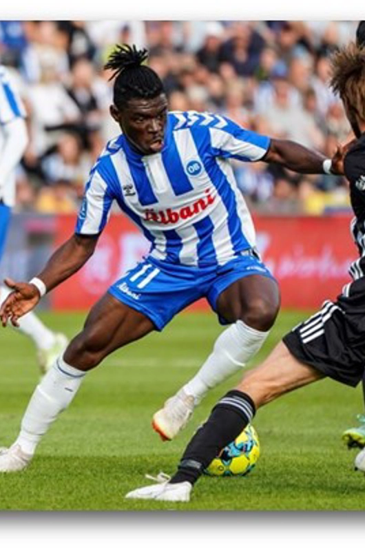 OB spiller dribler imod modtander 